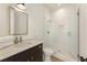 Elegant bathroom with walk-in shower and modern vanity at 10940 Serenbe Ln, Chattahoochee Hills, GA 30268