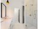 Modern bathroom featuring a glass shower, sleek vanity, and contemporary fixtures at 10940 Serenbe Ln, Chattahoochee Hills, GA 30268