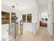 Open hallway with large windows providing natural light and scenic views at 10940 Serenbe Ln, Chattahoochee Hills, GA 30268