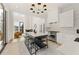Bright, open kitchen with a large island, stainless steel appliances, and access to the living area at 10940 Serenbe Ln, Chattahoochee Hills, GA 30268