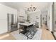 Modern kitchen featuring stainless steel appliances, marble countertops, and an island with seating at 10940 Serenbe Ln, Chattahoochee Hills, GA 30268