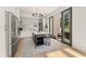 Sleek kitchen with a marble island, stainless appliances, and sliding doors to an outdoor patio at 10940 Serenbe Ln, Chattahoochee Hills, GA 30268