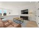 Cozy living room featuring comfortable seating and a modern fireplace at 10940 Serenbe Ln, Chattahoochee Hills, GA 30268
