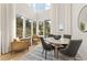 Bright, open living room with high ceilings and large windows offering scenic views at 10940 Serenbe Ln, Chattahoochee Hills, GA 30268