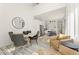 Elegant living room with dining area adjacent to a modern kitchen, great for entertaining at 10940 Serenbe Ln, Chattahoochee Hills, GA 30268