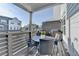 Cozy covered balcony perfect for outdoor dining, complete with table, chairs, and grill at 2225 Nena Way, Tucker, GA 30084