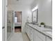 Bathroom featuring a double vanity, walk-in shower, and doorway to the bedroom at 2225 Nena Way, Tucker, GA 30084