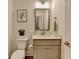 Charming half-bathroom featuring neutral tones, modern fixtures, and stylish decor at 2225 Nena Way, Tucker, GA 30084