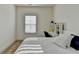 Comfortable bedroom area with a window and dedicated study space at 2225 Nena Way, Tucker, GA 30084