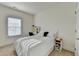 Cozy bedroom with a large window, neutral colors, and a dedicated study area at 2225 Nena Way, Tucker, GA 30084