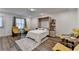 Bedroom featuring a murphy bed with built-in shelving and four modern yellow chairs at 2225 Nena Way, Tucker, GA 30084