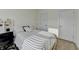Bedroom with neutral color scheme, study space and two entry doors at 2225 Nena Way, Tucker, GA 30084