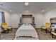 Cozy bedroom featuring wood floors, a Murphy bed, and comfortable seating in a modern style at 2225 Nena Way, Tucker, GA 30084