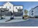 Exterior view of modern townhomes with private balconies, garages, and well-maintained landscaping at 2225 Nena Way, Tucker, GA 30084