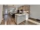 Spacious kitchen featuring stainless steel appliances, a large island, and open dining area at 2225 Nena Way, Tucker, GA 30084