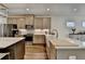 Bright, modern kitchen featuring stainless steel appliances and a large island at 2225 Nena Way, Tucker, GA 30084