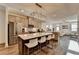 Open concept kitchen with stainless steel appliances and island with seating at 2225 Nena Way, Tucker, GA 30084