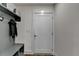 Well organized mudroom entry with a bench, storage, and hooks for outerwear and gear at 2225 Nena Way, Tucker, GA 30084