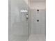 Sleek and modern shower with gray tile walls and glass enclosure at 2225 Nena Way, Tucker, GA 30084