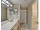 Bathroom with a large vanity and access to the walk-in closet at 30 Plantation Ne Dr # B, Atlanta, GA 30324