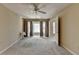 Bright bedroom features a ceiling fan, neutral walls, and natural light from the bay window at 30 Plantation Ne Dr # B, Atlanta, GA 30324