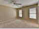 Neutral bedroom with two windows providing ample natural light and carpeted floors at 30 Plantation Ne Dr # B, Atlanta, GA 30324