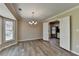 Inviting dining room bathed in natural light, complemented by an elegant chandelier and hardwood floors at 30 Plantation Ne Dr # B, Atlanta, GA 30324