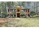Charming brick home featuring dual staircases and a welcoming, covered entryway with a columned portico at 30 Plantation Ne Dr # B, Atlanta, GA 30324