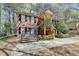 Exterior view of a brick home showcasing a unique dual staircase design leading to a covered entryway at 30 Plantation Ne Dr # B, Atlanta, GA 30324