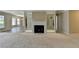 Spacious living room boasting a fireplace with mirrored shelving and natural light at 30 Plantation Ne Dr # B, Atlanta, GA 30324
