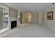 Spacious living room with fireplace and carpet flooring, perfect for entertaining at 30 Plantation Ne Dr # B, Atlanta, GA 30324