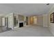 Large living room featuring a cozy fireplace and seamless access to the entryway and hallway at 30 Plantation Ne Dr # B, Atlanta, GA 30324