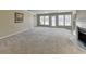 Living room with fireplace and access to a balcony or deck offering scenic views at 30 Plantation Ne Dr # B, Atlanta, GA 30324