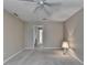 Cozy main bedroom featuring a ceiling fan, carpet flooring, and convenient access to the ensuite bathroom at 30 Plantation Ne Dr # B, Atlanta, GA 30324