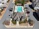 Aerial view of community pool, clubhouse, parking, and surrounding landscape at 3172 Havencroft Ne Dr, Roswell, GA 30075