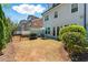 Lawn featuring a patio with an umbrella, a privacy fence and shrubs separating the neighboring properties at 3172 Havencroft Ne Dr, Roswell, GA 30075