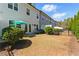 Backyard featuring a lawn and patios separated by privacy fences and a backdrop of tall trees at 3172 Havencroft Ne Dr, Roswell, GA 30075
