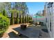 Outdoor area featuring a picnic table and seating arrangement with an umbrella for shade at 3172 Havencroft Ne Dr, Roswell, GA 30075
