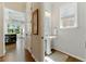 Bathroom with pedestal sink, window, and hardwood floors at 3172 Havencroft Ne Dr, Roswell, GA 30075