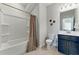 Clean bathroom includes tub and shower, modern fixtures, and vanity with sink at 3172 Havencroft Ne Dr, Roswell, GA 30075