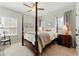 Beautiful bedroom featuring natural light, a ceiling fan, and elegant furnishings at 3172 Havencroft Ne Dr, Roswell, GA 30075