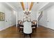 Dining room showcases hardwood floors, beamed ceiling, and chandelier with natural light at 3172 Havencroft Ne Dr, Roswell, GA 30075