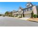 Attractive neighborhood street with well-maintained townhomes and manicured front yards at 3172 Havencroft Ne Dr, Roswell, GA 30075