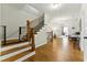 Elegant home foyer featuring hardwood floors, staircase and views into the living spaces at 3172 Havencroft Ne Dr, Roswell, GA 30075