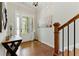 Bright foyer featuring hardwood floors and staircase with natural light and decor at 3172 Havencroft Ne Dr, Roswell, GA 30075