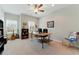 Spacious home office with a fan, windows and ample workspace for productivity at 3172 Havencroft Ne Dr, Roswell, GA 30075