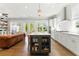 Bright kitchen with island seating, stainless steel appliances, and lots of cabinet storage space at 3172 Havencroft Ne Dr, Roswell, GA 30075