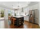 Modern kitchen with a center island and stainless steel appliances and hardwood floors at 3172 Havencroft Ne Dr, Roswell, GA 30075