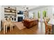 Living room featuring hardwood floors, built-in shelving, and a cozy fireplace at 3172 Havencroft Ne Dr, Roswell, GA 30075