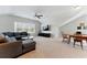 Spacious living room with ample seating, natural light, and vaulted ceiling at 3172 Havencroft Ne Dr, Roswell, GA 30075